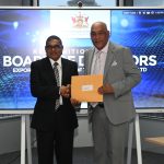 Senator the Honourable Satyakama Maharaj, Minister of Trade, Investment and Tourism, and Mr. Edwin Chariah, EXIMBANK Chairman.