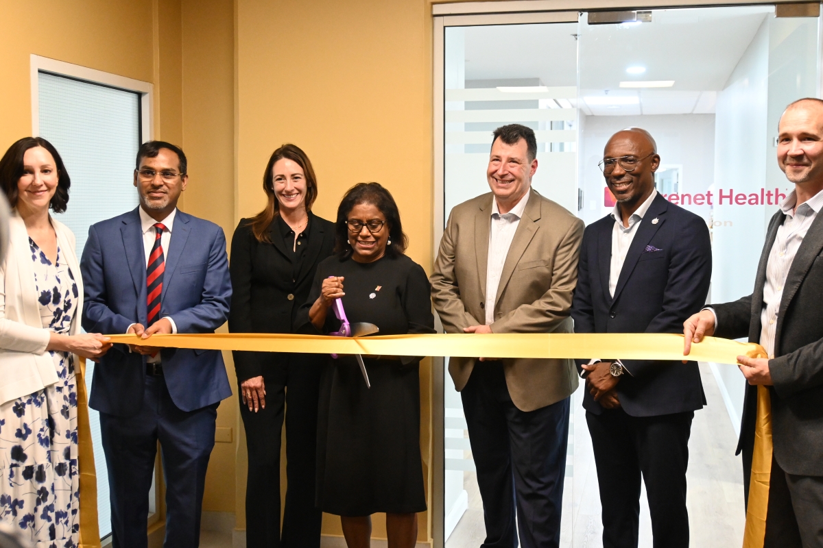 Minister Gopee-Scoon cuts ribbon at the opening of Carenet Health TT's office at Albion Plaza, Port of Spain