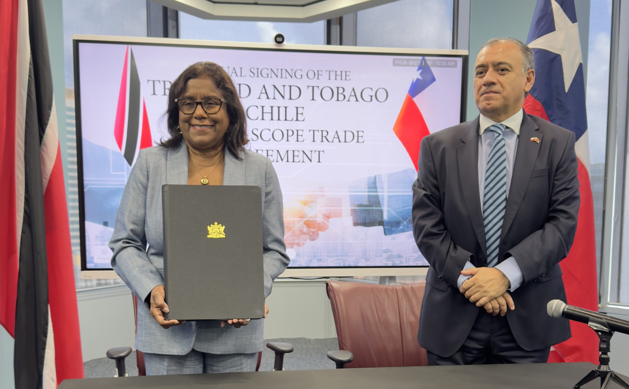 Minister of Trade and Industry, the Hon. Paula Gopee-Scoon and His Excellency Hernán Núñez Montenegro, Ambassador Extraordinary and Plenipotentiary of Chile to Trinidad and Tobago at the signing of a new Partial Scope Trade Agreement (PSTA) with the Republic of Chile at the Ministry's Head office in Port of Spain.