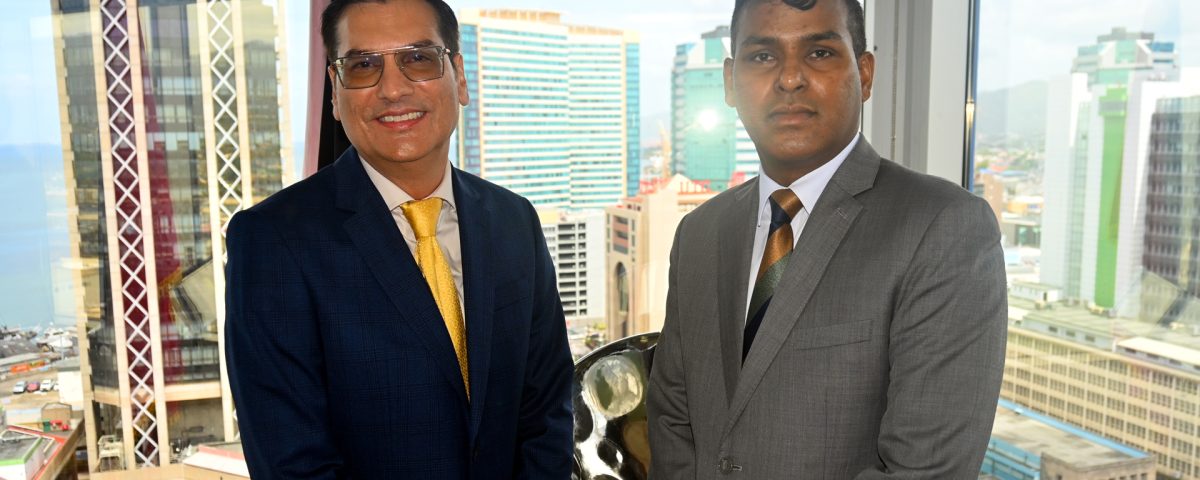 (left)Dr. Colin Neil Gosine, Parliamentary Secretary in the Ministry of Trade, Investment and Tourism, with (right) Mr. Randall Karim, Permanent Secretary in the Ministry of Trade, Investment and Tourism.