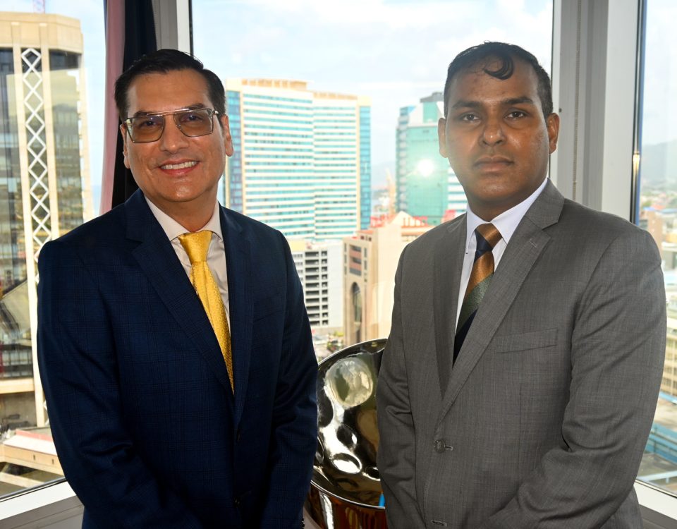 (left)Dr. Colin Neil Gosine, Parliamentary Secretary in the Ministry of Trade, Investment and Tourism, with (right) Mr. Randall Karim, Permanent Secretary in the Ministry of Trade, Investment and Tourism.
