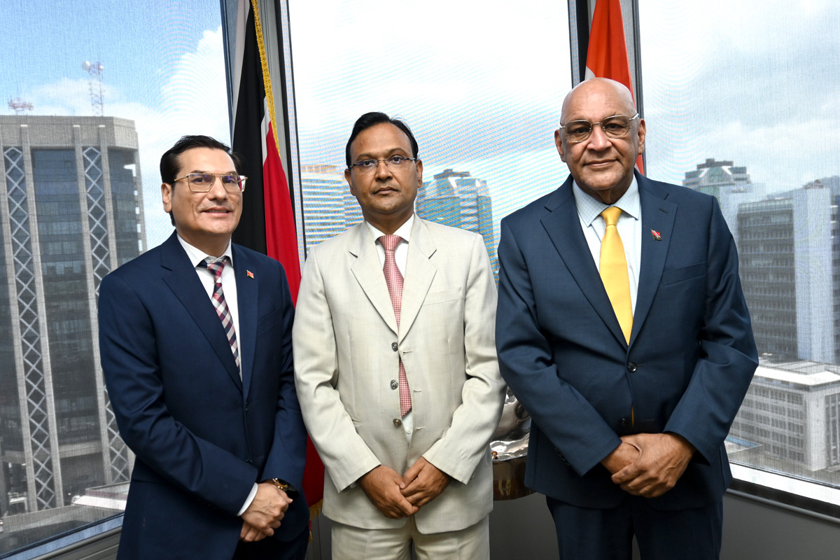 group photo of Minister, Parliamentary Secretary, and High Commissioner for the Republic of India