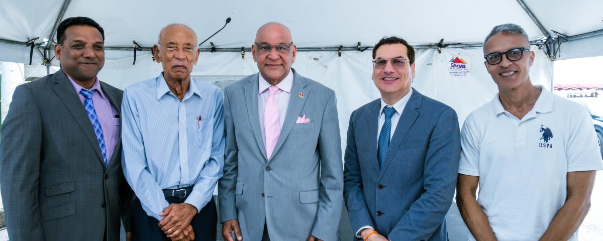 Group of of men including Senator the Honourable Satyakama Maharaj, Minister of Trade, Investment and Tourism (center) together with Dr. Colin Neil Gosine, MP, Parliamentary Secretary in the Ministry of Trade, Investment and Tourism (second from left), Mr. Anthony Pinto, Chairman of the Board of Directors, GC Resorts Ltd. (left), Mr. Ken Gordon, GC Resorts Advisor, and Dr. Kirk Meighoo, GC Resorts Director.