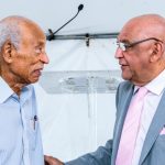 Senator the Honourable Satyakama Maharaj, Minister of Trade, Investment and Tourism (right) in discussions with Mr. Ken Gordon, GC Resorts Advisor.