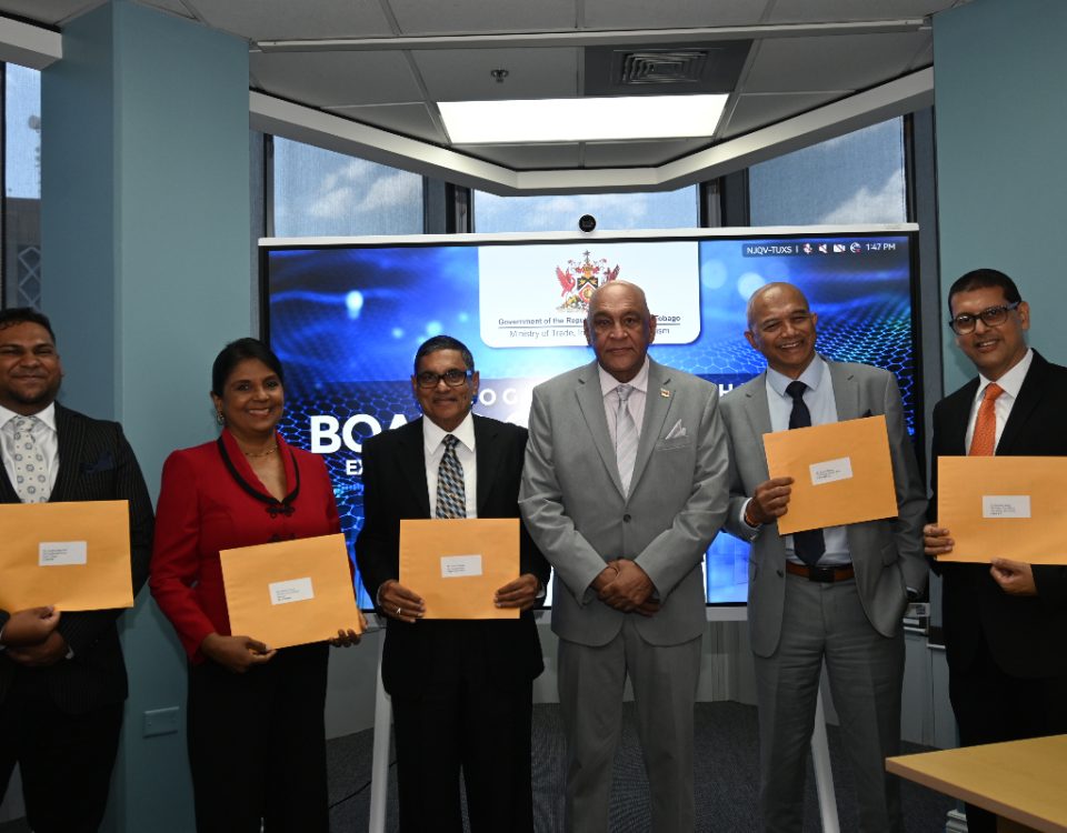 Senator the Honourable Satyakama Maharaj, Minister of Trade, Investment and Tourism (third from right); Mr. Edwin Chariah, EXIMBANK Chairman (third from left); Mr. Suresh Maharaj, Deputy Chairman (second from right); Ms. Nandini Narine, Director (second from left); Dr. Bhushan Singh, Director (right); and Mr. Joseph Ridge Paul, Director (left).