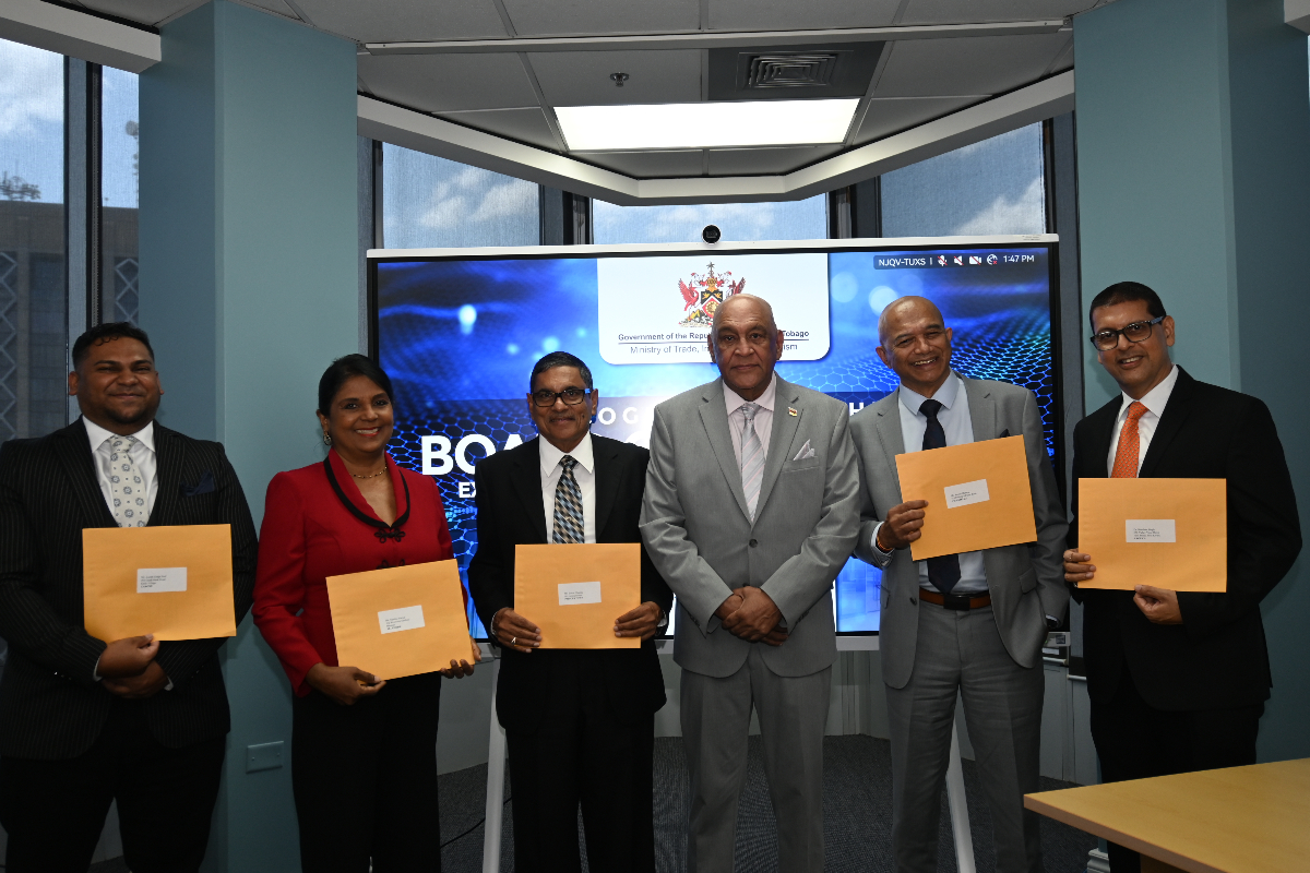 Senator the Honourable Satyakama Maharaj, Minister of Trade, Investment and Tourism (third from right); Mr. Edwin Chariah, EXIMBANK Chairman (third from left); Mr. Suresh Maharaj, Deputy Chairman (second from right); Ms. Nandini Narine, Director (second from left); Dr. Bhushan Singh, Director (right); and Mr. Joseph Ridge Paul, Director (left).