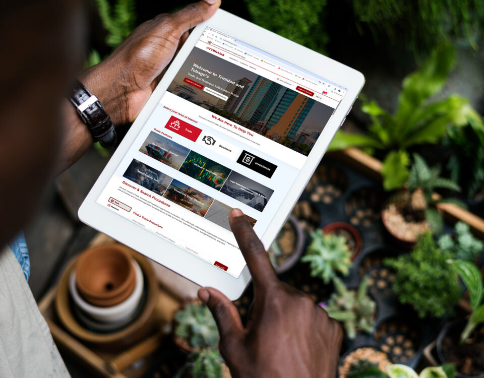 Picture of tablet and plants in background