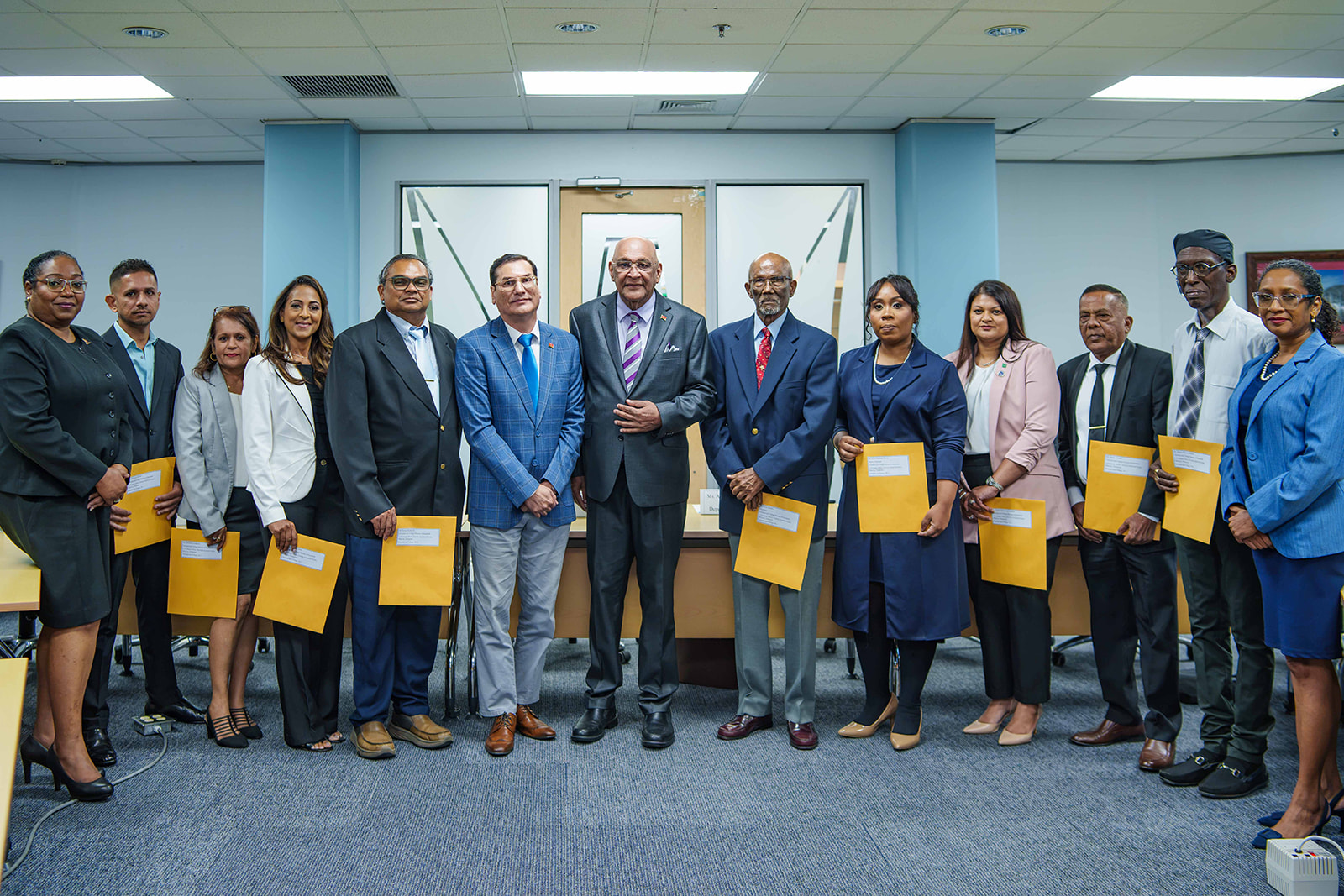 Group photo of the Board of Directors of TTBS with Minister, Parliamentary Secretary and Permanent Secretary